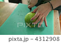 Teenage girl slicing apple 4312908