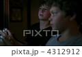 Two boys playing video games 4312912
