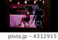 Woman sitting at cocktail bar 4312915