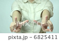 A woman's hand, fingering a piece 6825411