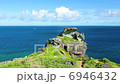 Ocean rock and sailboat in Tropical country 6946432