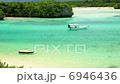A tropical ocean and a ship 6946436