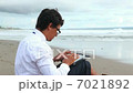 Working at beach  7021892