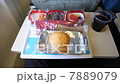 Tray of food: salad, fruit, bread, drink on the plane. 7889079