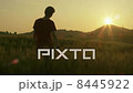 Young man walking with raised in wheat field hands at sunset time. 8445922