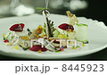 Chef serving Delicious Smoked Fish Selection in Luxury Restaurant. Close-up 8445923