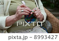 hands of old woman knitting wool, close up 8993427