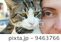 close-up portrait of a beautiful girl with holding cat 9463766