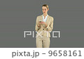 Businesswoman texting on the phone 9658161