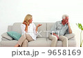 Retired couple arguing on the couch 9658169