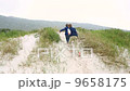 Siblings playing on the sand dunes 9658175