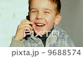 Child speak on the phone and laughi 9688574