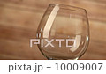 Pouring red wine and wooden background 10009007