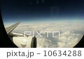 airplaine flight over clouds, porthole view 10634288