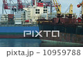 Cargo ships moored on the background of dock cranes 10959788