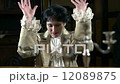 Female in romanesque garment gestures with her hands as a good piano player 12089875