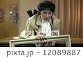 Mistress laying in prone position picks up a frame and frames herself 12089887