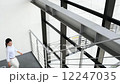 Business women climbing stairs 12247035