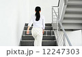 Business woman climbing stairs 12247303