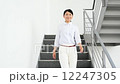 Business woman descending the stairs 12247305