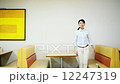 A young woman dining room leaves from sitting 12247319