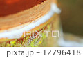 Tapping latex from a rubber tree in Thailand  12796418