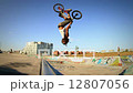 Extreme Sport BMX Bicycle Rider Doing Tricks in Concrete Skate Board Park 12807056