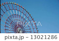 Timelapse of ferris wheel over blue sky. 13021286