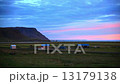 Farm buildings at sunset in Iceland 13179138