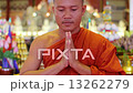 buddhist monk with orange robe pray in temple 13262279