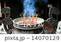 Incense Sticks Burning in Giant Pot in Front of Buddhist Temple  14070129