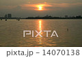 Zoom Out - Time Lapse of Golden Sunset Reflections on a Lake in Hanoi Vietnam 14070138
