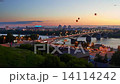 Sky lanterns flying over river and bridge at night 14114242