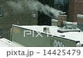 chimney blowing smoke in the winter 14425479