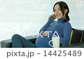 Asian pregnant woman siting in a sofa 14425489