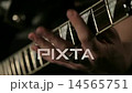 guitarist playing rock riff on electric guitar 14565751