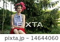 Beautiful Retro Fashion Model With Headscarf Sits On Swing In Garden 14644060