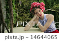 Beautiful Fashion Model Wearing Hair Curlers And Headscarf Poses In Garden  14644065