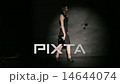 Professional Fashion Model Wearing Black Dress Poses In Studio  14644074
