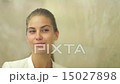 beautiful woman applying makeup on lips 15027898