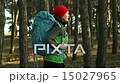Hiker woman walking hiking in forest with backpack 15027965