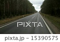 Moving on road through forest trees 15390575