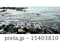 Waves on stones on shore or coast of ocean or sea 15403810