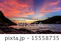 Beautiful moving clouds over ocean at sunset 15558735