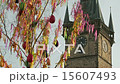 Old clock tower behind the waving Easter fringes 15607493