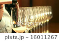 Sommelier pouring rose wine into crystal glasses 16011267