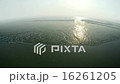 Sunset Over the Ocean with Gentle Waves. 16261205