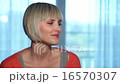 woman smiling at her home 16570307