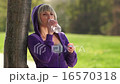 woman drinking from bottle 16570318