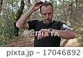 runner looks at smart watch 17046892